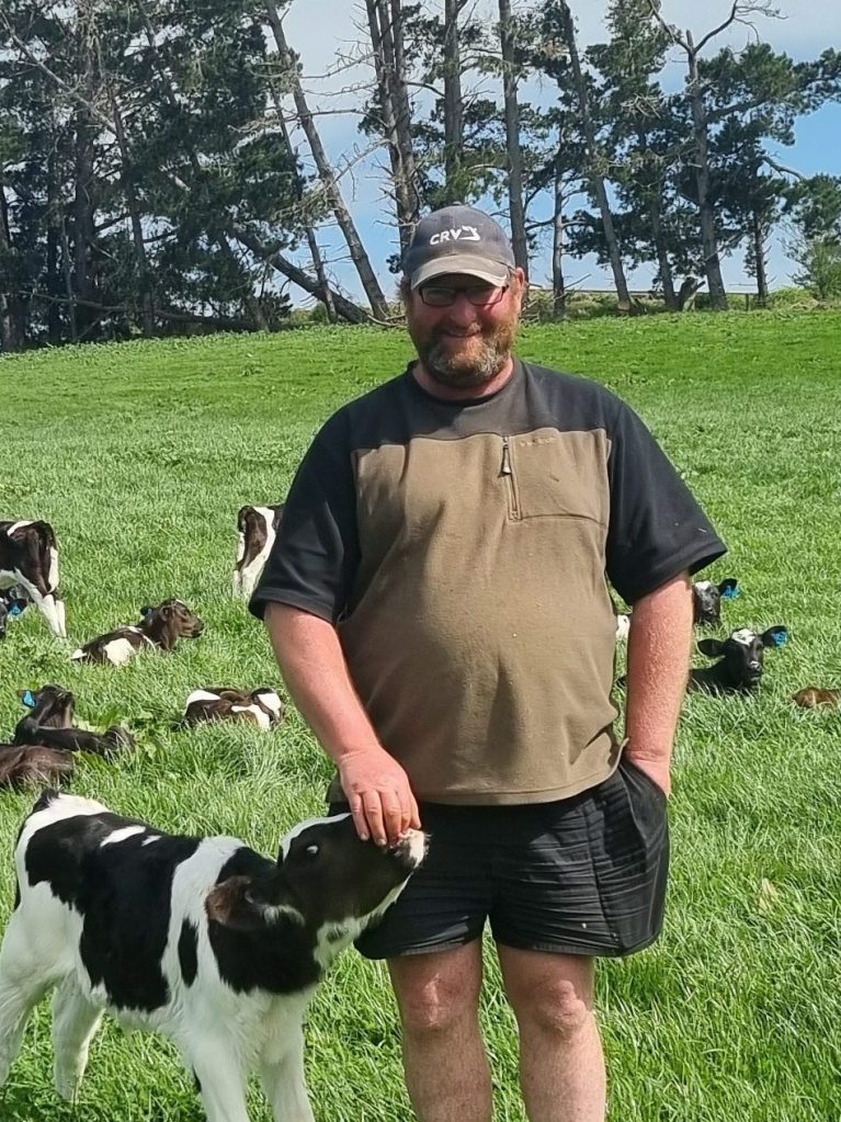 Calf and farmer